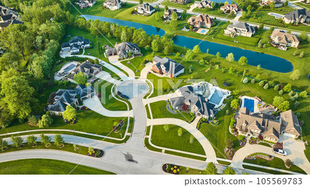 Aerial million-dollar homes rich neighborhood of houses with clean blue ponds Aerial million-dollar homes rich neighborhood of houses with clean blue ponds 105569783