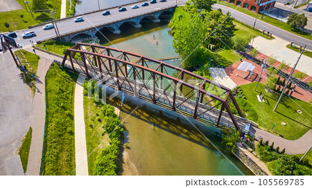 Walking and regular bridge crossing over river in rural Mount Vernon Ohio aerial 105569785