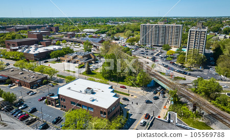 Cityscape aerial condos renting with pool parking lots and cars near two train tracks city landscape Cityscape aerial condos renting with pool parking lots and cars near two train tracks city landscape 105569788