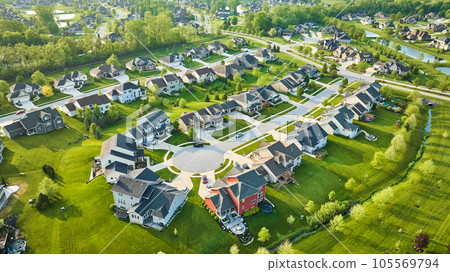 Mini mansion homes in rich neighborhood with lush landscaping in summer Mini mansion homes in rich neighborhood with lush landscaping in summer 105569794