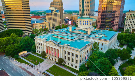 Aerial over Capital Square Foundation Columbus Ohio with golden sunlight hitting skyscrapers 105569851
