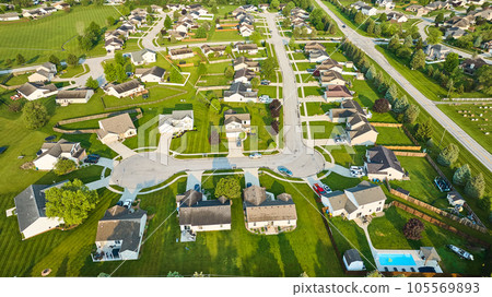 Neighborhood houses middleclass homes green lawns aerial 105569893