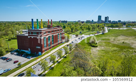 Cityscape skyline architecture background, aerial field, traffic, renovated power plant smokestacks 105569912