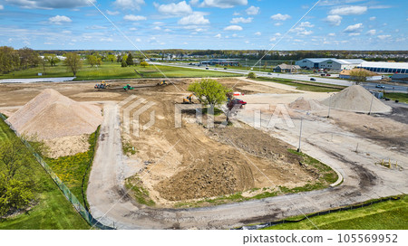 Construction deconstruction zone area grass field, stone gravel pile aerial Construction deconstruction zone area grass field, stone gravel pile aerial 105569952