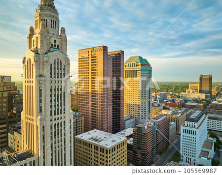 Golden lighting striking Huntington and LeVeque Towers at sunrise in Columbus Ohio aerial of city 105569987