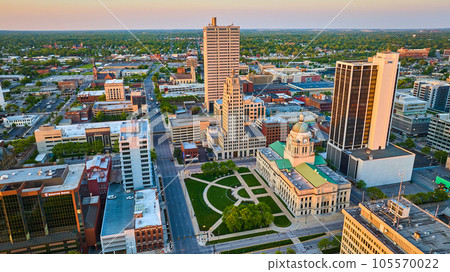 Architecture courthouse green lawn Fort Wayne IN aerial sunrise pink glow skyscrapers 105570022
