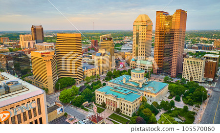 Capital Square Foundation at sunrise with sun on skyscrapers aerial 105570060