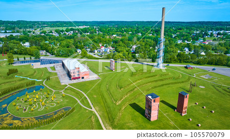 Aerial of abandoned freight elevators and tower near tree trail in Ariel Foundation Park 105570079