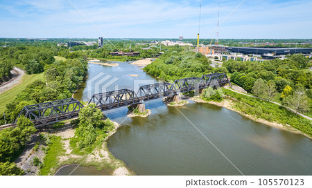 Train bridge over Scioto River with forested area aerial 105570123