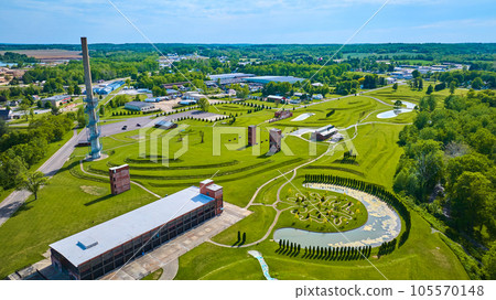 Aerial of Ariel Foundation Park during summer with decaying buildings and tree path park 105570148