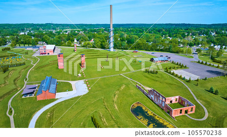 Ariel Foundation Park wide shot of destroyed factory buildings and walking paths aerial 105570238