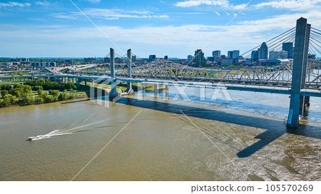 Downtown Louisville KY skyline skyscraper horizon aerial boat in Ohio River and bridge Downtown Louisville KY skyline skyscraper horizon aerial boat in Ohio River and bridge 105570269