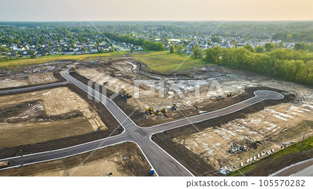 Housing construction aerial bulldozer, bobcat cul-de-sac with paved road distant houses neighborhood Housing construction aerial bulldozer, bobcat cul-de-sac with paved road distant houses neighborhood 105570282