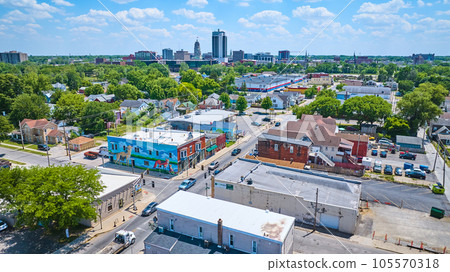 Aerial near downtown Fort Wayne with distant skyscrapers and Wells Street fox and wolf mural 105570318