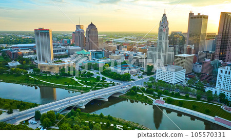 Aerial Scioto River and bridge with park and heart of downtown skyscrapers at sunrise 105570331