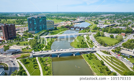 Scioto River aerial with multiple bridges and kayaks on water near city 105570333
