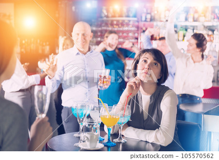 Bored woman at corporate party Bored woman at corporate party 105570562