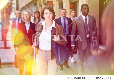 Hurrying woman walking on street Hurrying woman walking on street 105570774