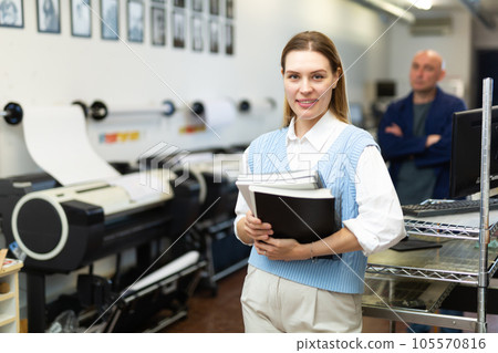 Portrait of positive woman printing office worker Portrait of positive woman printing office worker 105570816