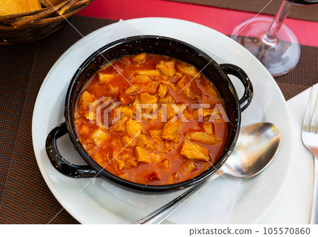 Stew with tripe, chickpea, chorizo and bacon in sauce Stew with tripe, chickpea, chorizo and bacon in sauce 105570860