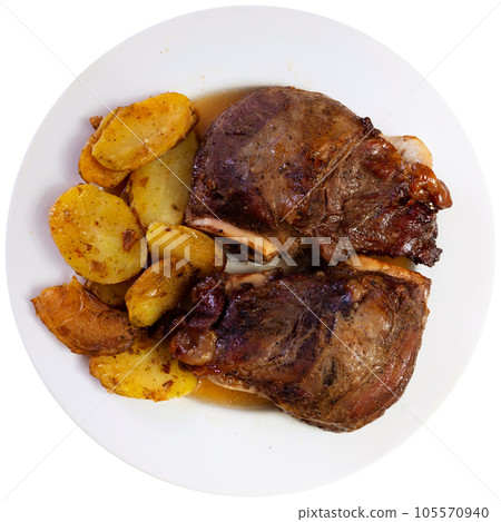 Baked pork cheeks with potato and aioli sauce 105570940