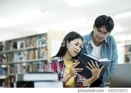 Young students campus helps friend catching up and learning. Young students campus helps friend catching up and learning. 105572071