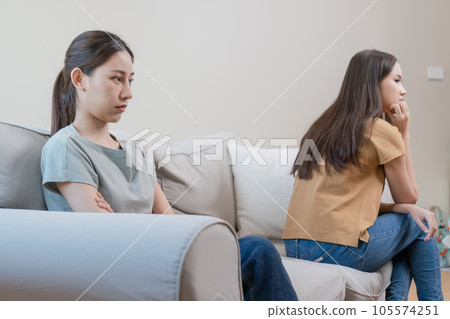 Unhappy asian girl couple. Homosexual love trouble. LGBT Lesbian girlfriends out of love. 105574251