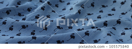 Wavy blue fabric with flamingo picture. 105575840