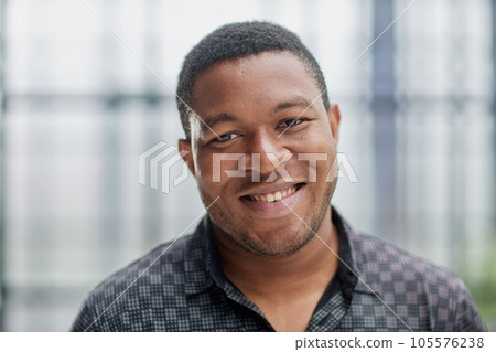 african american man in blurred office closeup 105576238