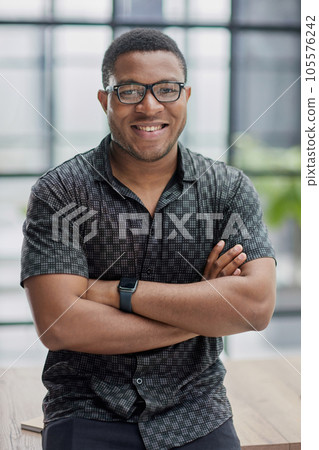 african american man in blurred office closeup 105576242