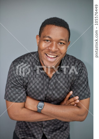 Portrait of an attractive cool guy on a gray background 105576449