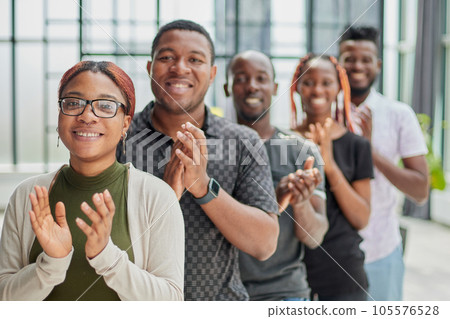 participants of the international business seminar give a standing ovation 105576528