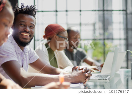 Diverse millennial business colleagues sharing laptop. Teamwork, corporate education concept 105576547