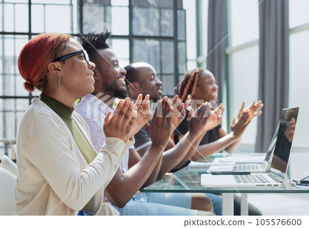 brokers in headphones with raised hands celebrating victory brokers in headphones with raised hands celebrating victory 105576600