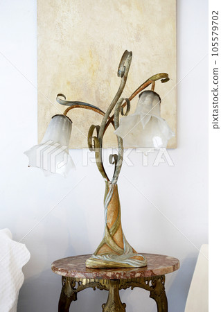 Western style room interior Antique table lamp with glass shade made in Italy Western style room interior Antique table lamp with glass shade made in Italy 105579702