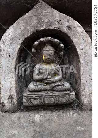 Stone statuette of sitting Buddha in Swayambhunath. Now destroyed after the earthquake that hit Kathmandu, Nepal 105579754
