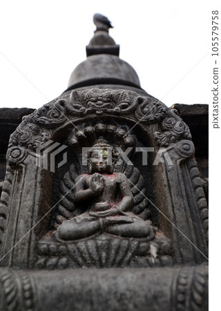 Stone statuette of sitting Buddha in Swayambhunath. Now destroyed after the earthquake that hit Kathmandu, Nepal 105579758