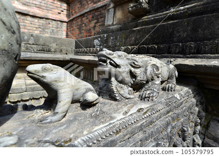 Carved stone animals on a public fountain in Kathmandu, Nepal 105579795