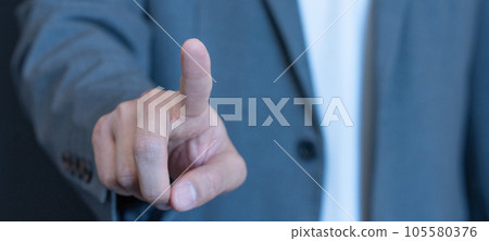 Close-up banner size of a young man's fingertips about to press a button Close-up banner size of a young man's fingertips about to press a button 105580376