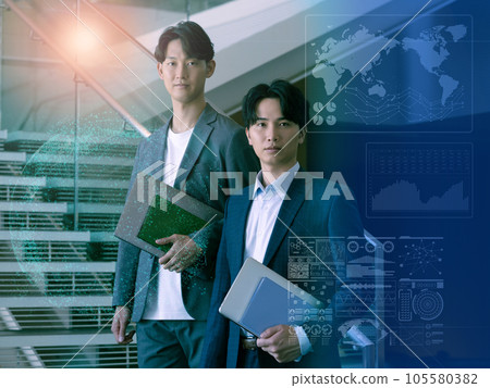 Portrait of two young men standing on the stairs of an office building DX image 105580382