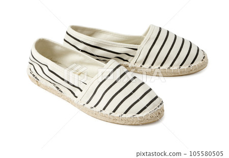 Casual summer women's textile loafers. A new pair of shoes on a white background Casual summer women's textile loafers. A new pair of shoes on a white background 105580505
