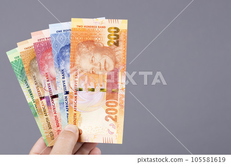 South African money in the hand on a gray background 105581619