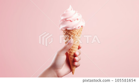 Hand-holding strawberry ice cream cone in pink faded pastel color Hand-holding strawberry ice cream cone in pink faded pastel color 105581654