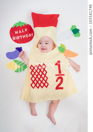 Baby wearing costume on half birthday 105581746