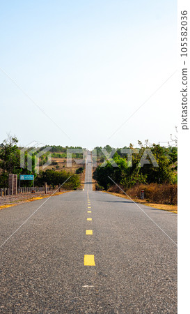 Photo for Affirmation about goal and right way. Never Stop Motivational. Beautiful view of empty asphalt road yellow line mountain nature Photo for Affirmation about goal and right way. Never Stop Motivational. Beautiful view of empty asphalt road yellow line mountain nature 105582036