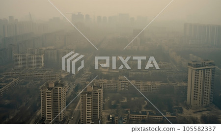 Top view of a dusty or smog-filled modern city with high-rise buildings Top view of a dusty or smog-filled modern city with high-rise buildings 105582337