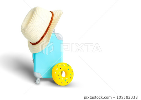A little blue suitcase on wheels, a straw hat, and a yellow inflatable donut A little blue suitcase on wheels, a straw hat, and a yellow inflatable donut 105582338