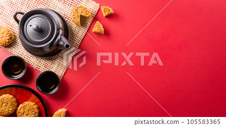 Chinese Mid-Autumn Festival concept made from mooncakes, tea and plum blossom. Chinese characters FU in the article refer to fortune good luck, wealth, money flow. Chinese Mid-Autumn Festival concept made from mooncakes, tea and plum blossom. Chinese characters FU in the article refer to fortune good luck, wealth, money flow. 105583365