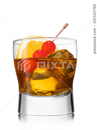 Old fashioned cocktail with cherries on still pick and orange slice on white. Old fashioned cocktail with cherries on still pick and orange slice on white. 105583769