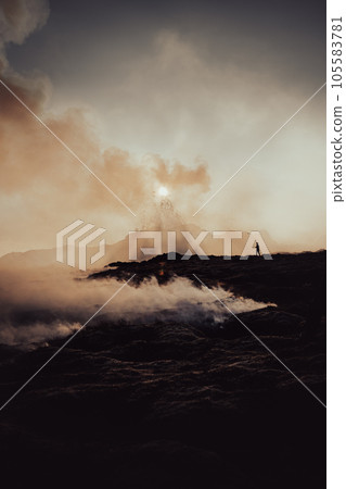 A drone pilot next to the volcano with spattering of boiling erupting molten lava. 105583781